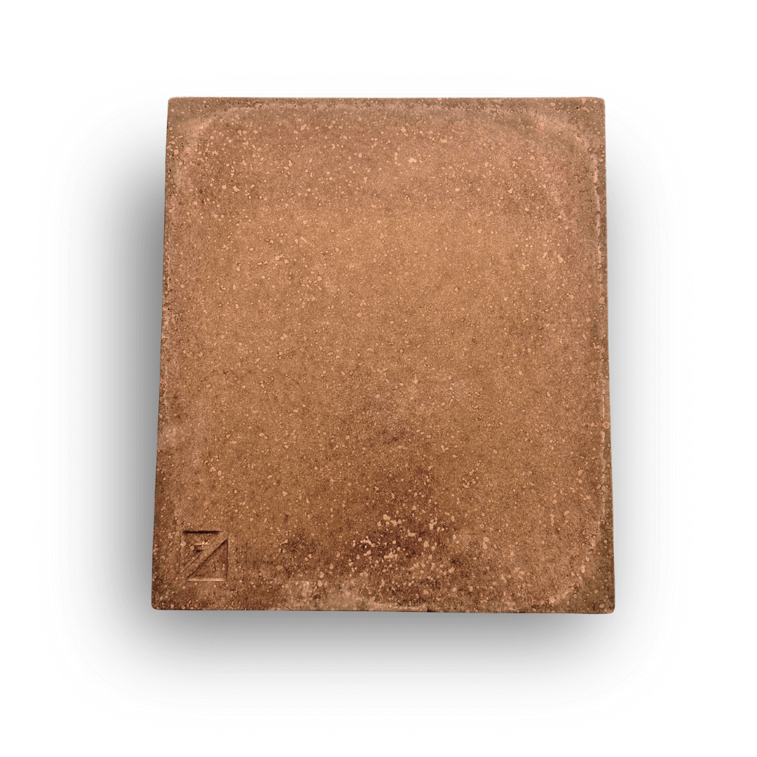 The Effeuno Biscotto Clay Pizza Stone is a square, textured brown stone resembling a brick or tile. It features an embossed Z in the bottom left corner and is made from claystone to achieve an authentic Neapolitan pizza finish, set against a crisp white background.