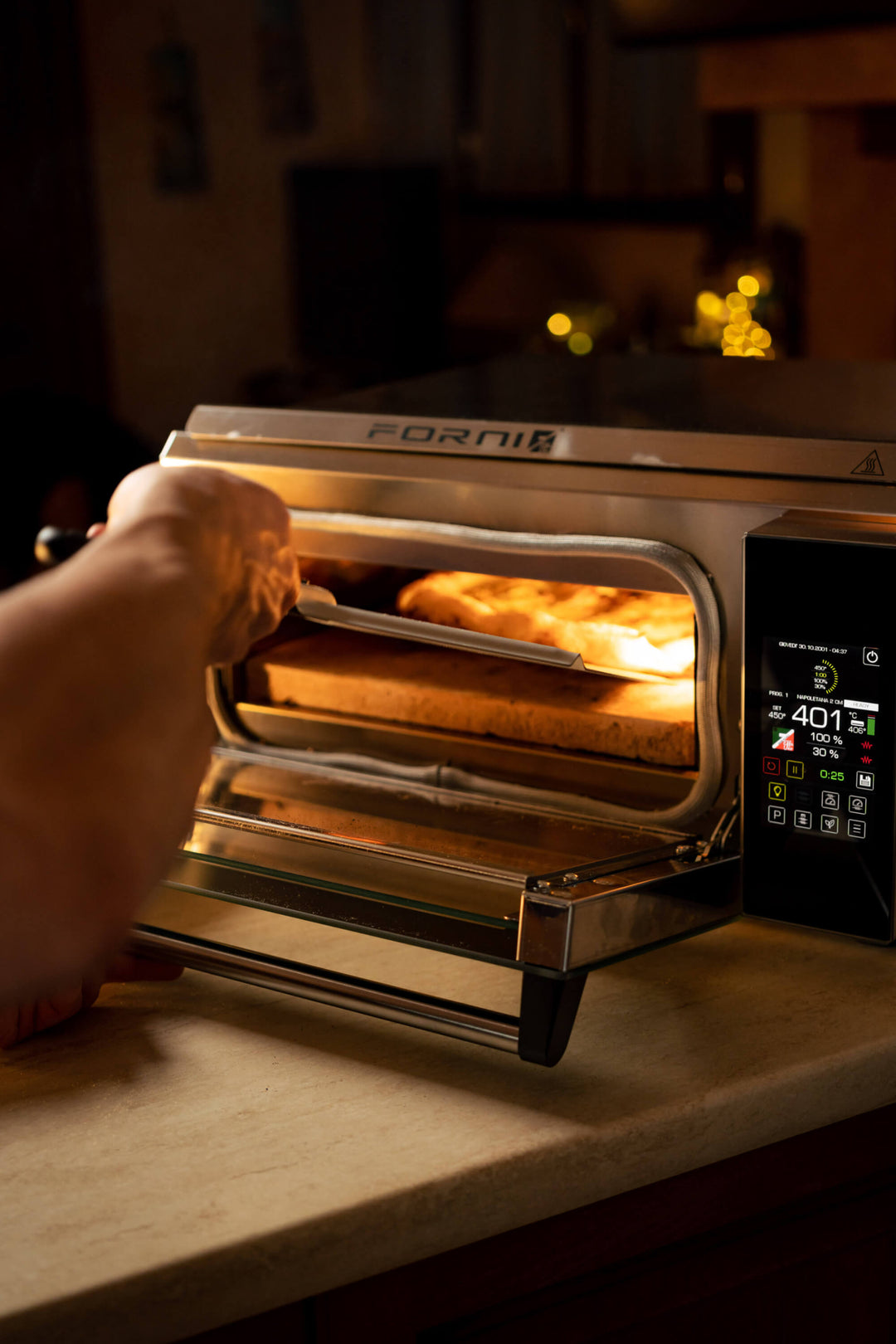 Pizza Peel being put into Effeuno Pizza Oven to get out a cooked Pizza