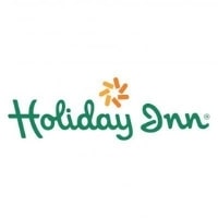 Logo of Holiday Inn featuring the brand name in green cursive letters with a stylized orange starburst design above. The background is white.