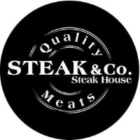 Black circular logo with white text that reads Quality Meats STEAK & Co. Steak House in various fonts and sizes. The design has a classic, minimalist style.