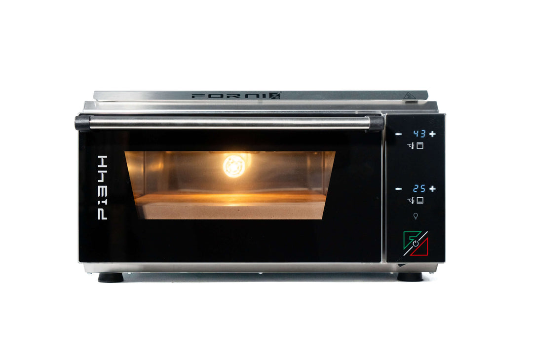 A compact black and stainless steel countertop Effeuno Pizza Oven P134H 509 PRO + Biscotto Stone has a digital side control panel. The door is closed, with an interior light illuminating the empty chamber, resembling a professional design. The brand Effeuno is visible on top.