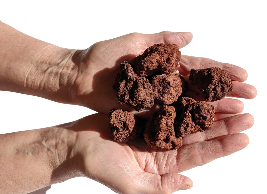 small pile of lava rocks in male hands