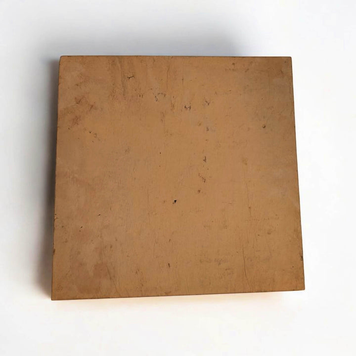 The Effeuno Naples Small Biscotto Clay Pizza Stone (32x32x2cm) is square, flat, and tan-colored with a smooth finish and minor marks—perfect for Neapolitan pizza in Ooni or other high-heat ovens.