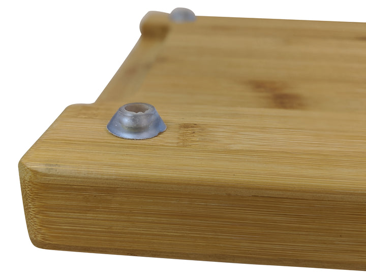 Close-up of the Black Rock Grill Large Wooden Serving Board corner with a rounded edge and translucent rubber foot. The sustainable board has a smooth, natural finish, visible grain patterns, ideal for custom laser engraving. Size: 44cm x 27cm x 3cm, available in a case of 6.
