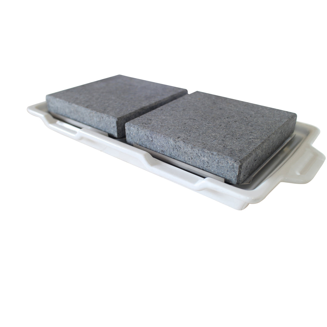 Two textured gray stone slabs are placed on a flat white tray with handles, embodying the classic simplicity of Black Rock Grills GP-3 White Porcelain Double Rock Platters. The image features an isolated white background.
