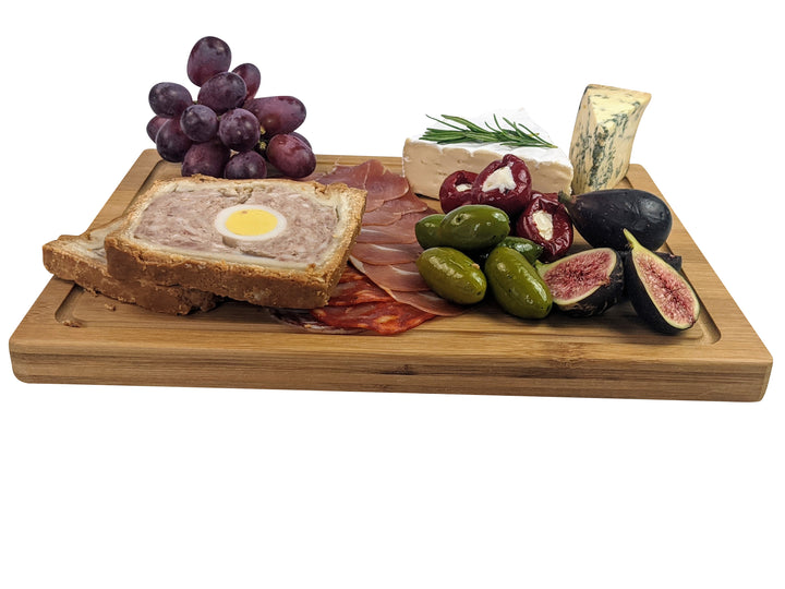 Black Rock Grills Wooden Serving Steak Boards present a delightful array: pâté en croûte with a hard-boiled egg, sliced cured meats, green olives, figs, cheeses with rosemary, and red grapes. Ideal for eco-friendly elegance at any gathering. Buy in packs of two.