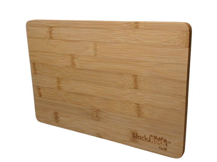 The Black Rock Grill 24 Wooden Serving Boards, sized at 30 x 20 x 1.2cm, are crafted from sustainable bamboo with a smooth light brown finish, subtle grain pattern, and rounded edges. A small logo in the bottom right corner allows for optional custom laser engraving.