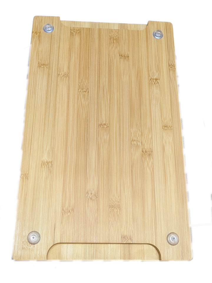 The GP-7 Bamboo Boards by Black Rock Grill, designed for Steak Stone Cooking Sets, are rectangular with a smooth, light brown surface and subtle grain. These sustainable pieces include four small round metal fittings at the corners, ideal for mounting or custom engraving. Sold in cases of six.