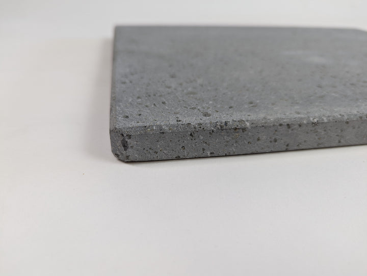 side view of the baking lava stone showing the thickness of the stone. solid