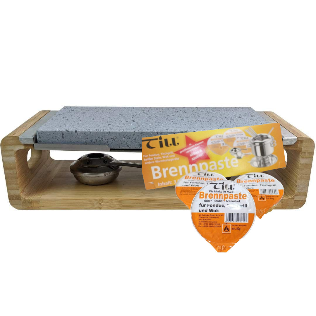 The Black Rock Grill Steak Stone Sharing Platter & Grill Set features a wooden frame with a sleek stone surface, and includes a metal burner with fondue-use fuel paste, making it ideal for tabletop cooking and hot stone grilling.