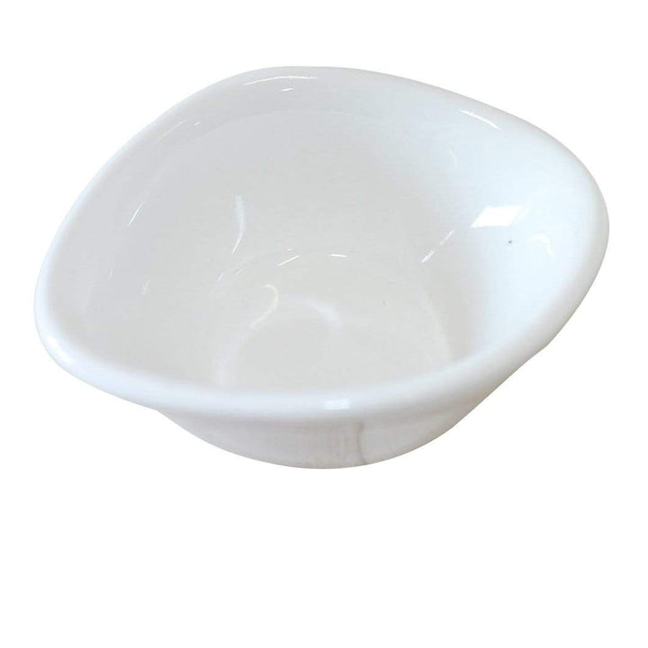 Viewed from above, a white ceramic bowl with a wavy asymmetrical rim and glossy finish resembles the elegance of Black Rock Grills 12 White Porcelain Ramekin Dipping Pots. The background is plain white, enhancing its simplicity.