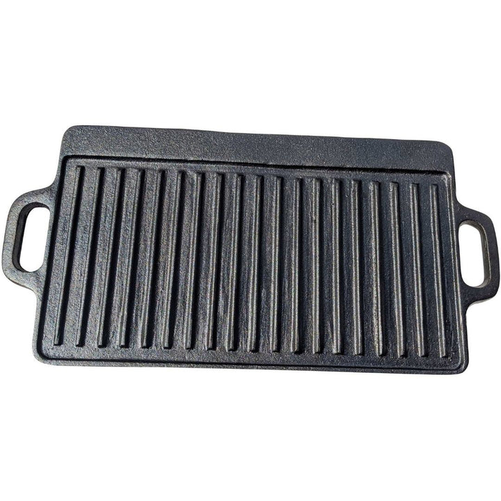 The Black Rock Grill Large Reversible Cast Iron Griddle Pan (46cm x 23cm) features raised ridges and silicone grip handles, perfect for grilling on gas, electric hob, or oven. Includes marinating oil brush.