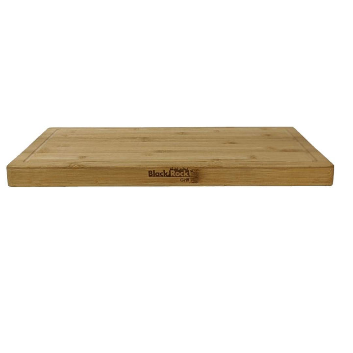 The Large Wooden Serving Board by Black Rock Grill features a smooth, natural finish with custom laser engraving and an edge groove, combining function with style.