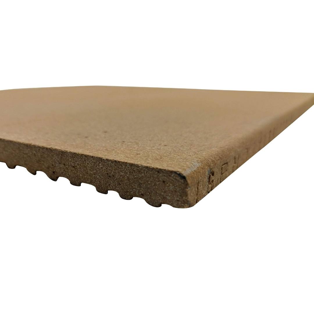 A close-up of a rectangular, brown composite decking board with its grooved underside and smooth top surface is reminiscent of the sleek finish found in Black Rock Grills Pizza Oven Refractory Brick Shelf, highlighting the boards texture and construction.