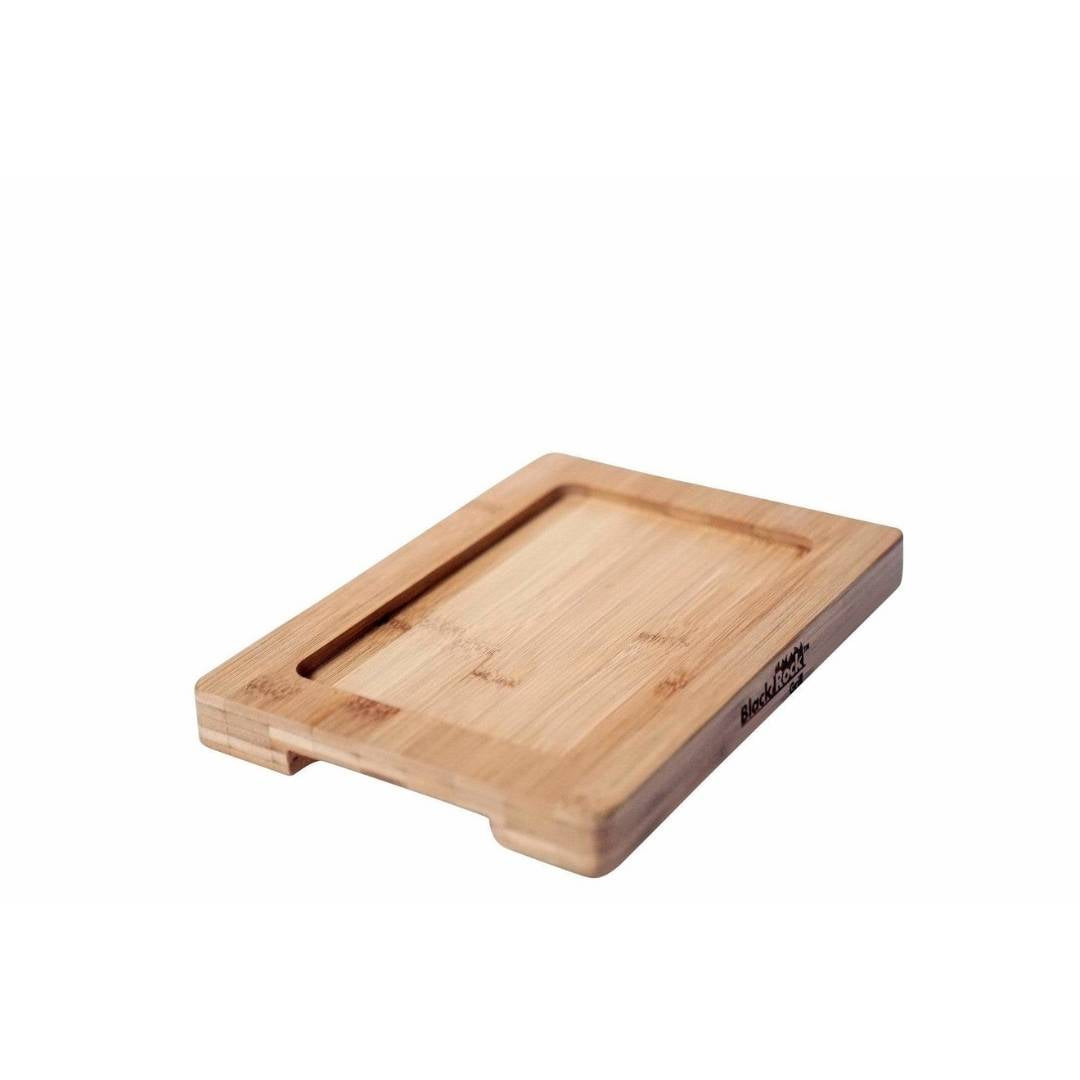 The GP-28 Bamboo Board, a rectangular cutting board crafted from sustainable bamboo with a smooth surface and recessed groove, is showcased on a white background. The Black Rock Grill logo adorns one side, seamlessly combining functionality with eco-friendly style.