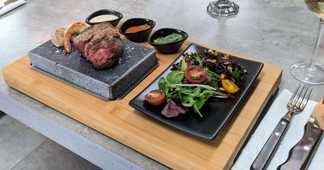 steak cooking on a natural lava steak stone 