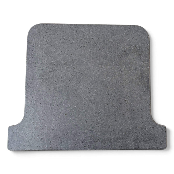 Top view of a grey Lava pizza oven stone that fits the ooni koda 16 pizza oven square with rounded corners and a stepped, notched edge on one side, shown on a plain white background.