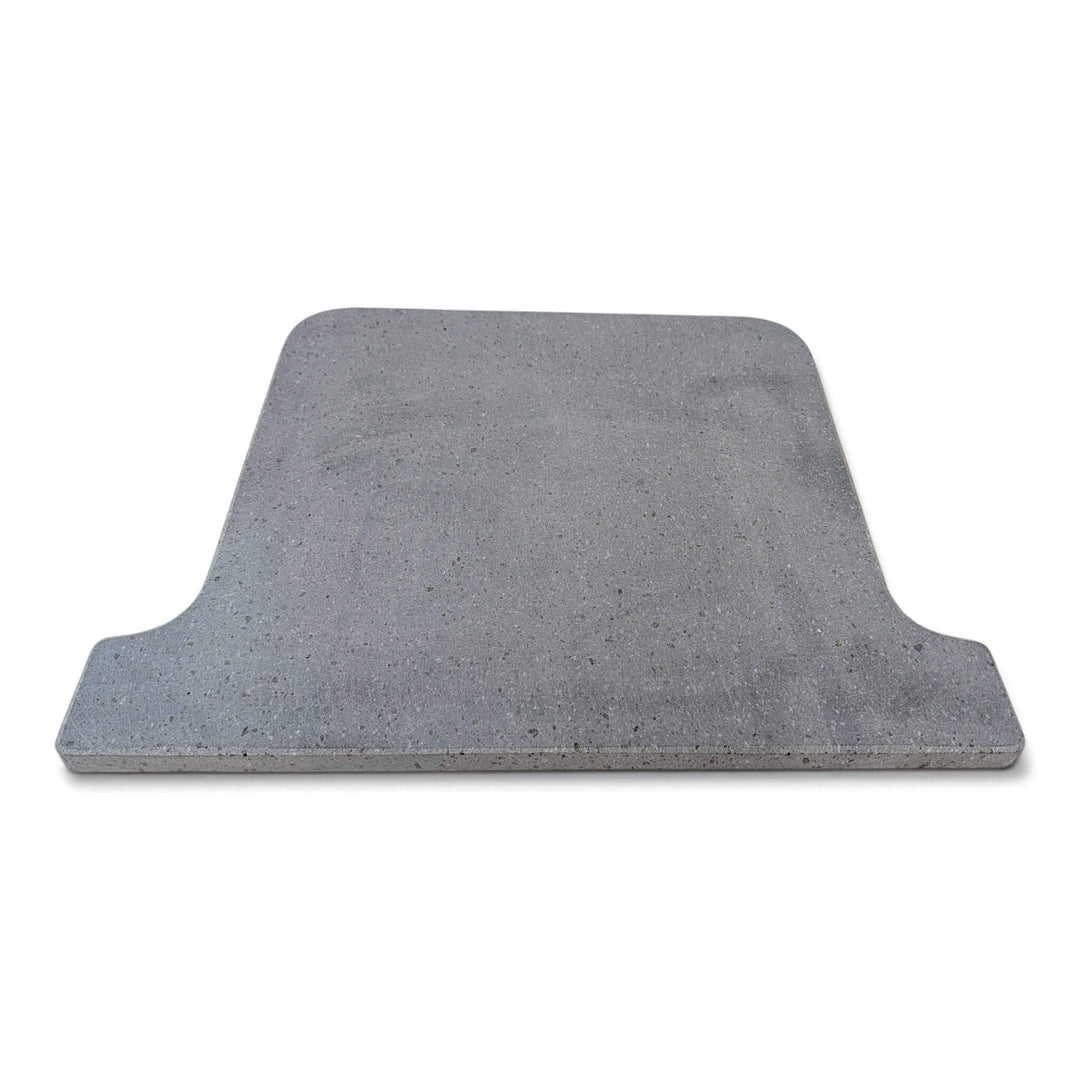 A grey Lava pizza oven stone that fits the ooni koda 16 pizza oven square with rounded corners and a stepped, notched edge on one side, shown on a plain white background.