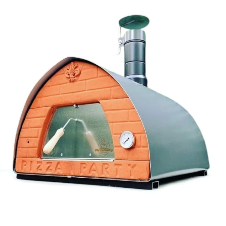 A dome-shaped outdoor pizza oven with a terracotta orange brick-patterned front, a dark stone color metal outer shell, a metal door, a built-in thermometer, and a tall dark chimney stack. The words &