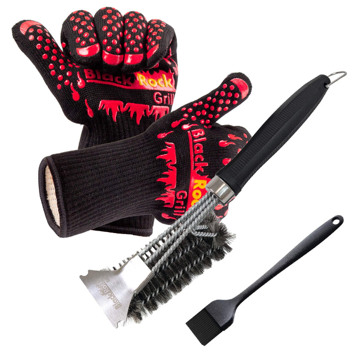 The Black Rock Grill Ultimate BBQ Tool Kit features 500°C heat-resistant black and red gloves, an 18" grill brush with a black handle, and a black silicone basting brush—all displayed on a white background.