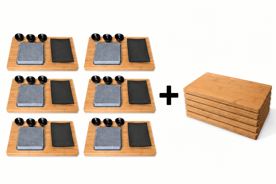 a set of six lava stone cooking sets with a square lava rock black side plate and three black dipping pots with a plus symbol to the right of them and a stack of six bamboo chopping boards to the right of that again.