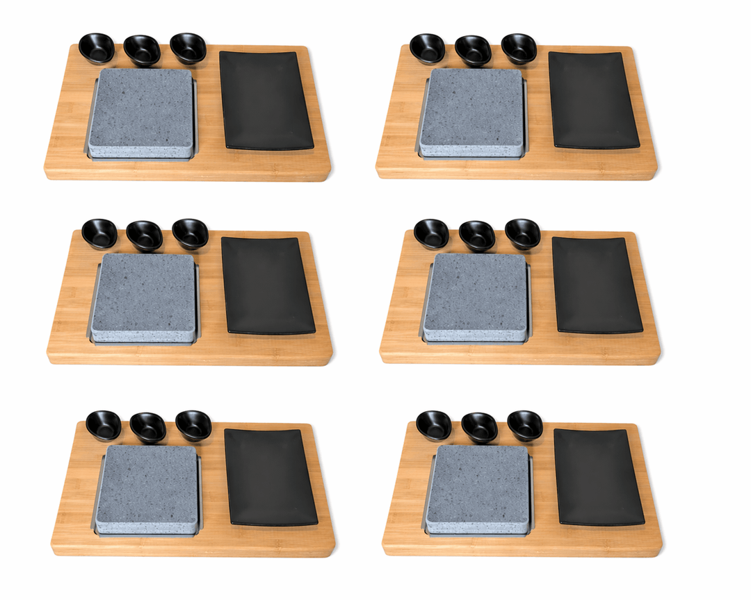 Set of six Black Rock Grill HO-09PMB steak stones with bamboo boards matt black porcelain side plates and dipping pots on a white background