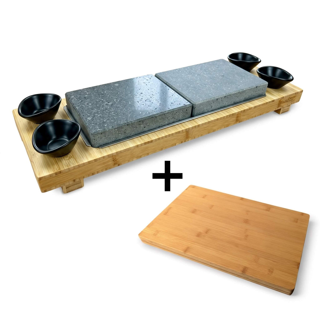 Experience restaurant-quality dining at home with the Black Rock Grill Signature Steak Sharing Stone Set, featuring a bamboo serving tray, two stone slabs, four black bowls, and a FREE rectangular bamboo board (worth £19.99)—an all-in-one versatile set perfect for sharing steak or presenting your favorite dishes in style.