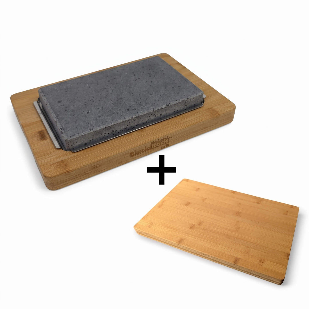 The Black Rock Grill Lava Sizzler Finishing Warming Platter is displayed in its wooden tray above a plus sign, next to the included FREE rectangular bamboo serving board (worth £19.99), all set against a white background.
