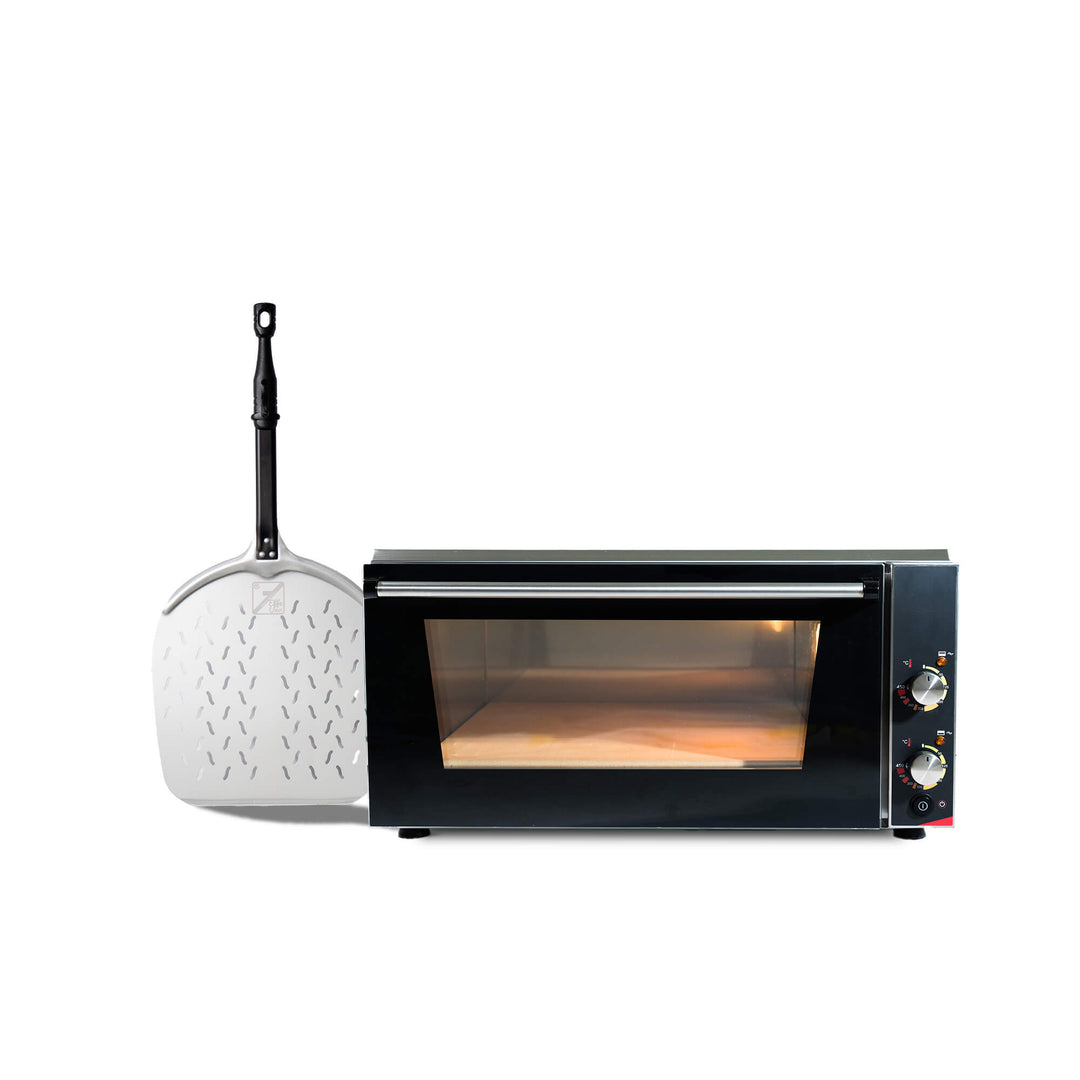 The Effeuno Pizza Oven P150HA, featuring a glass door and control knobs, sits next to a large metal pizza peel with a black handle, highlighting the sleek professional design typical of Effeuno ovens.