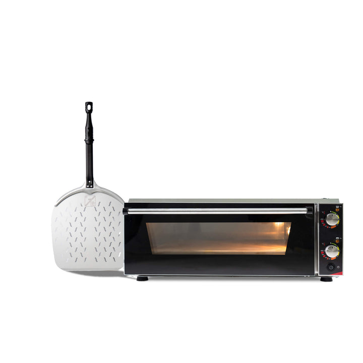 The Effeuno P150H Pizza Oven in black, featuring a glass door and control knobs, is displayed beside a metal pizza peel with a long black handle, showcasing the professional and sleek design by Effeuno.
