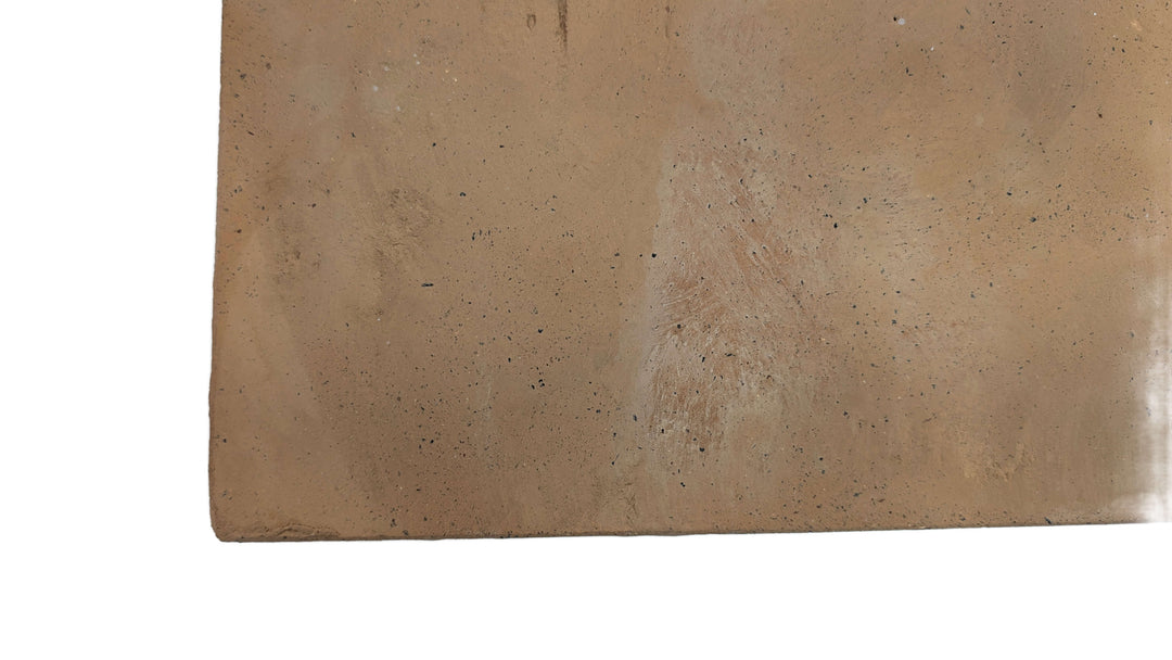 A detailed close-up of the Effeuno XL Biscotto Clay Pizza Stone (50x50x2cm), handmade in Naples, shows its light brown, textured and speckled surface—with subtle discolorations—resembling authentic Neapolitan-style baking.