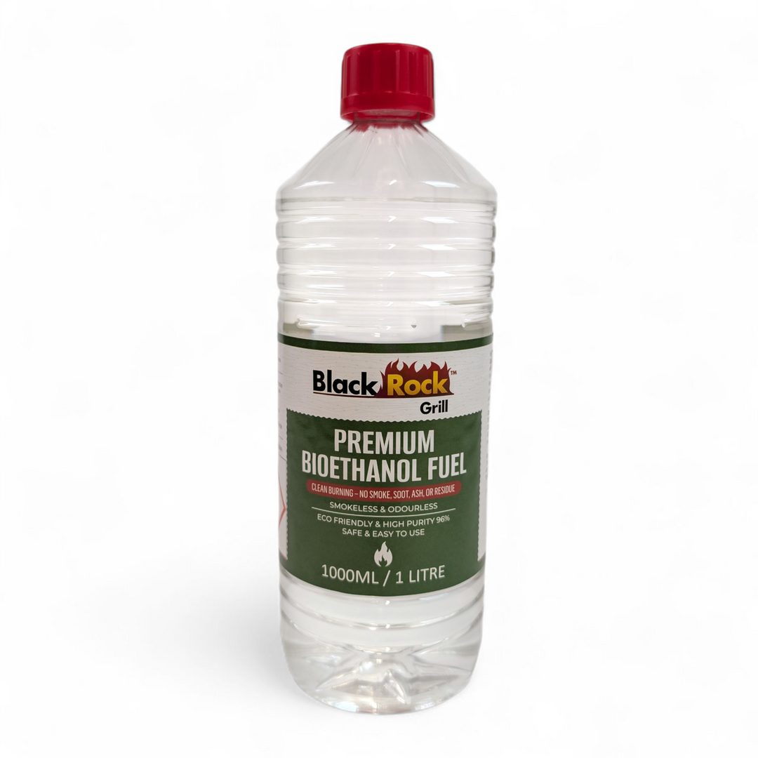 A 1L clear bottle of Black Rock Grill Premium Bioethanol Fuel contains plant-based, smokeless, and odourless liquid for fireplaces, fire pits, and stoves—offering clean burning and eco-friendly performance.