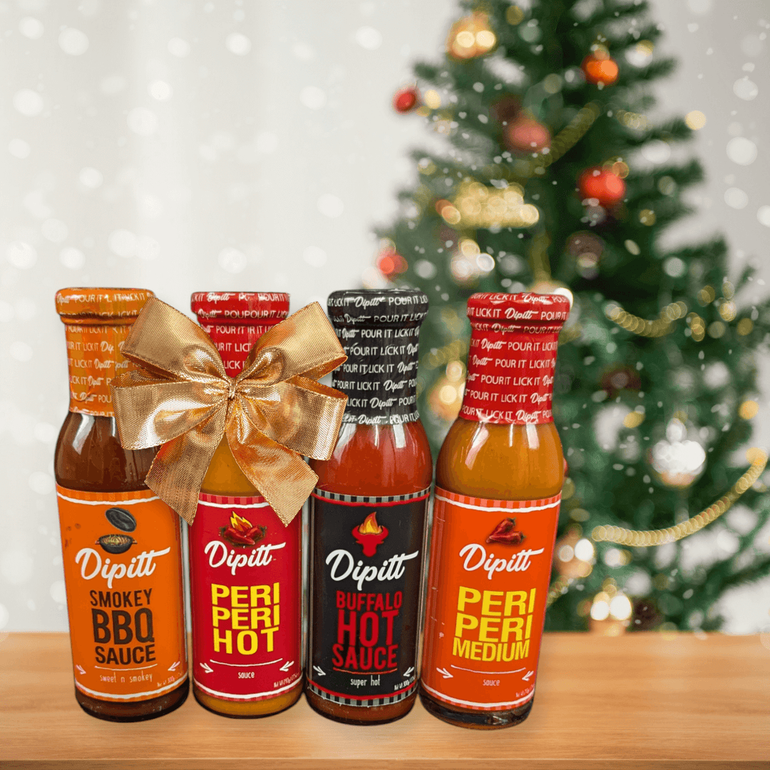 Dipitt Gift Set- Peri Peri Medium and Hot, Buffalo Hot Sauce, Smokey BBQ Sauce Christmas background. Perfect gift for foodies