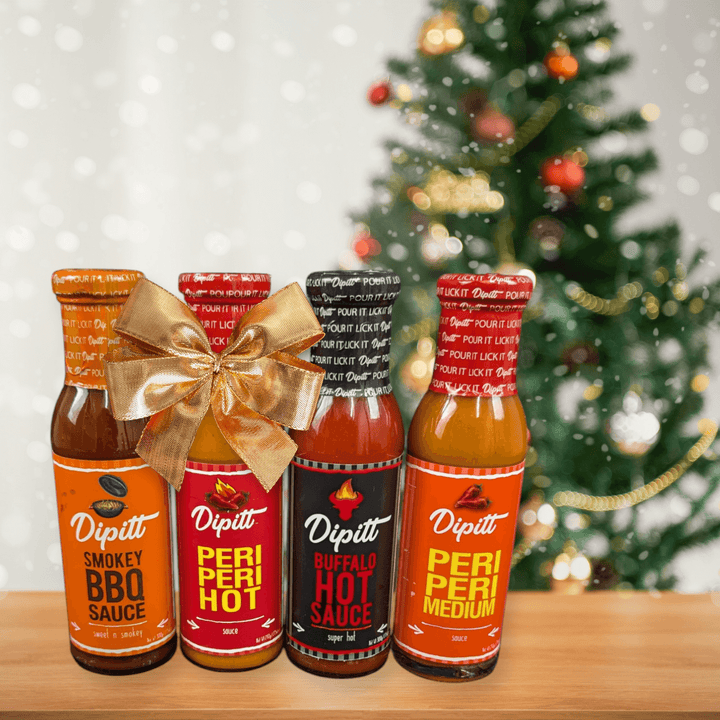 Dipitt Gift Set- Peri Peri Medium and Hot, Buffalo Hot Sauce, Smokey BBQ Sauce Christmas background. Perfect gift for foodies