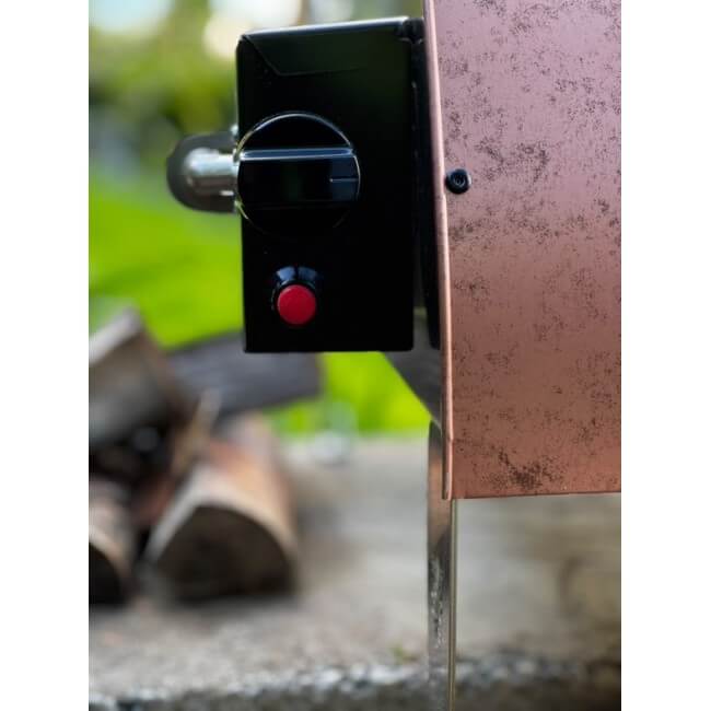 A close-up view of the gas controls and ignition dial on the Pizza Party Ispirazione outdoor pizza oven.