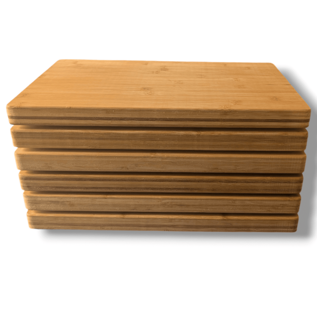 A set of six Premium Extra Large Thick Butcher Block Chopping Boards from Black Rock Grill is neatly stacked, highlighting the bamboo wood grain against a white background.