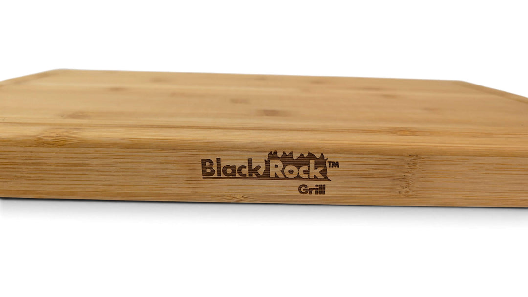 Close-up of the laser printed Black Rock Grill logo on the surface of a thick sustainable bamboo cutting board.
