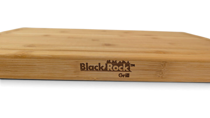 Close-up of the laser printed Black Rock Grill logo on the surface of a thick sustainable bamboo cutting board.