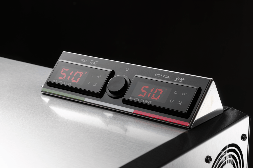 Detailed view of the digital PID temperature controllers on the Macte Advanced electric pizza oven.