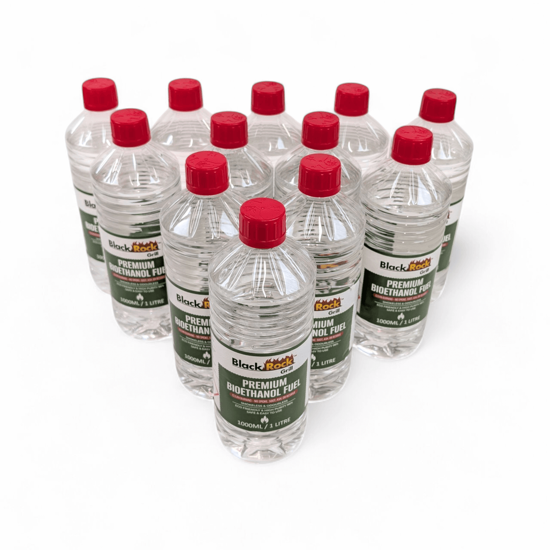 Twelve clear plastic bottles with red caps, labeled “Black Rock Grill Premium Bioethanol Fuel – 1L Plant-Based Clean Burning Liquid for Fireplaces,” are arranged in a triangle on a white background. Each eco-friendly bottle contains sustainable fuel.