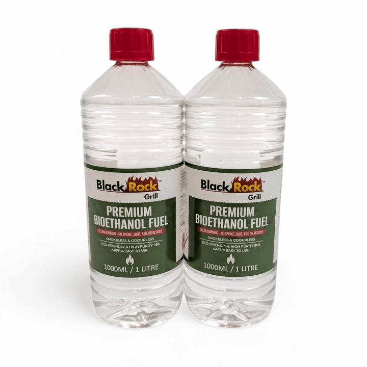Two 1L bottles of Black Rock Grill Premium Bioethanol Fuel—plant-based, clean-burning liquid for fireplaces, fire pits & stoves—stand side by side with red caps on a white background.