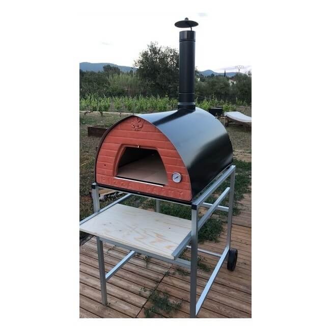 Passion pizza oven mounted on a silver stand, set up on outdoor wooden decking.