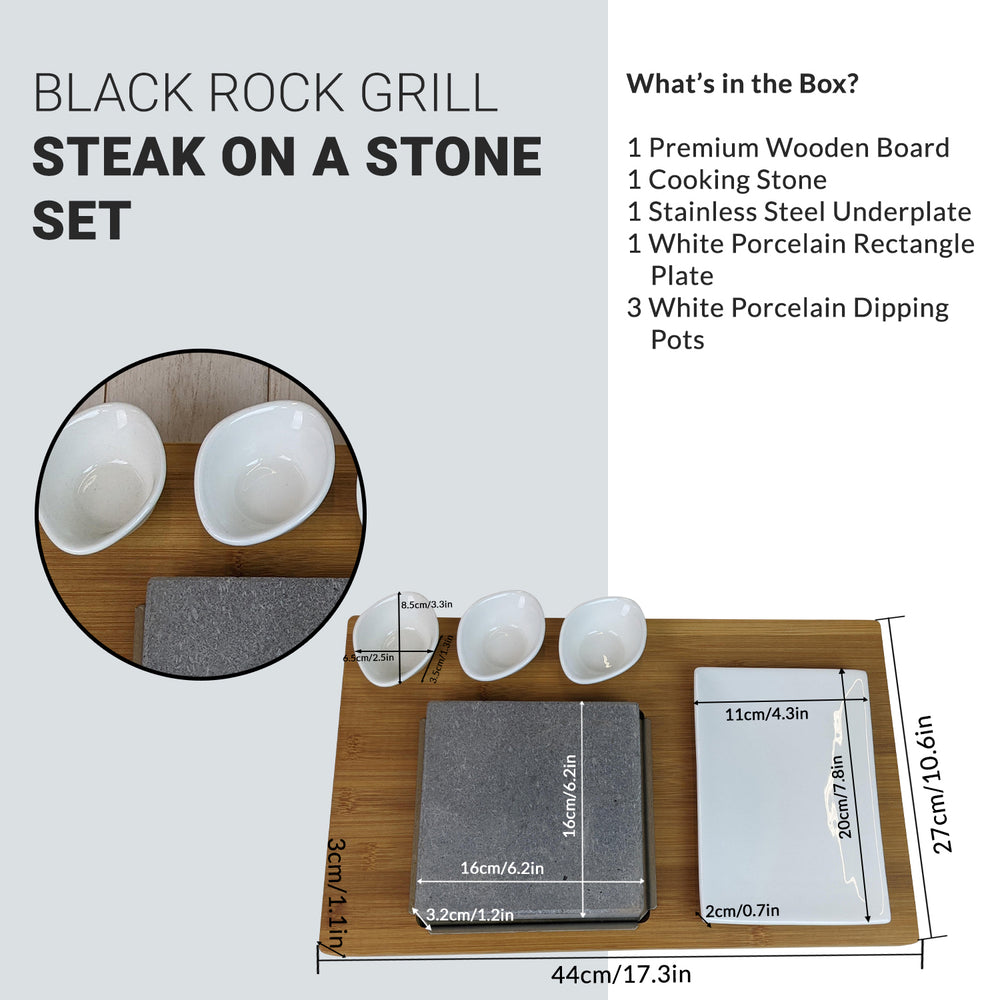 Image of the Black Rock Grill Steak on the Stone Gift Set. Ideal for steak enthusiasts, it features a wooden board, cooking stone, stainless steel underplate, white porcelain plate, and three dipping pots. Measurements are provided in centimeters and inches.