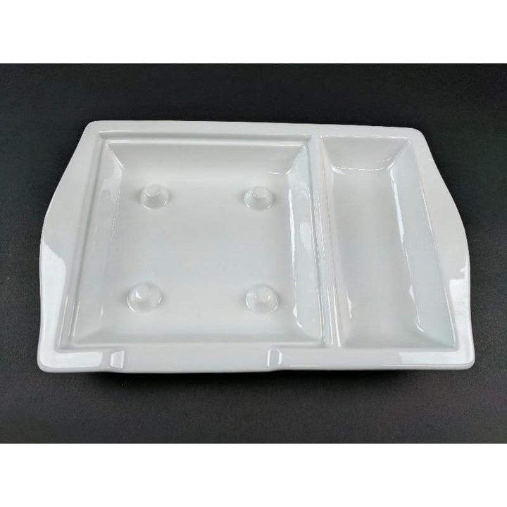 The Premium White Porcelain Steak Stone Platters by Black Rock Grill, GP-10 set of 6, features a white ceramic tray with two sections—a larger square left area and a smaller rectangular right one—on a dark base, ideal for stylishly serving sizzling steaks.